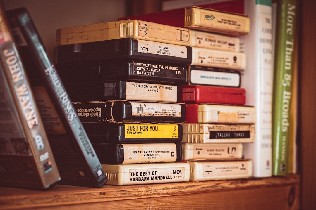 Stack of vintage videotapes and film archive reels