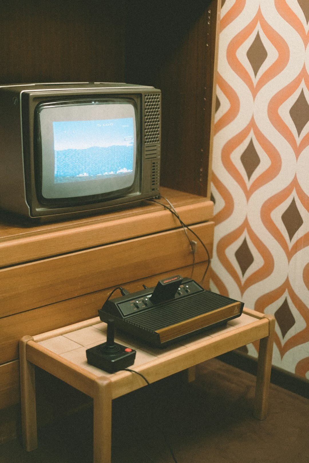 Retro CRT television set glowing in a cozy 1980s living room