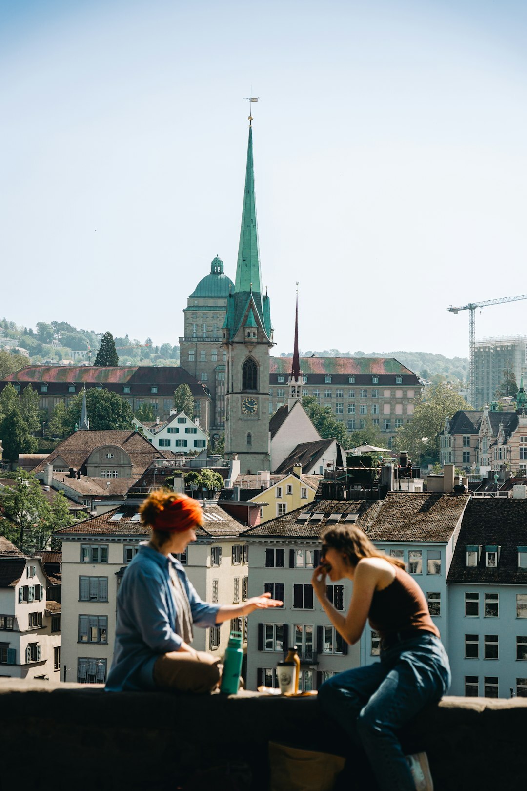 Swiss man and woman reviewing archived television footage together on a monitor
